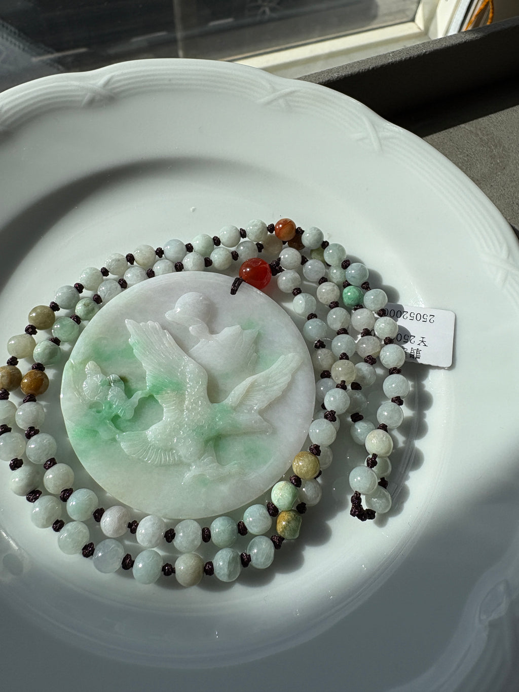Jade necklace with carved pendant