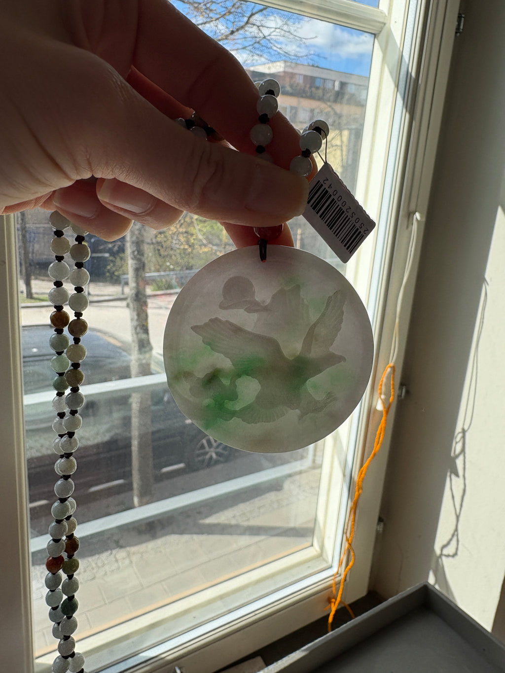 Jade necklace with carved pendant