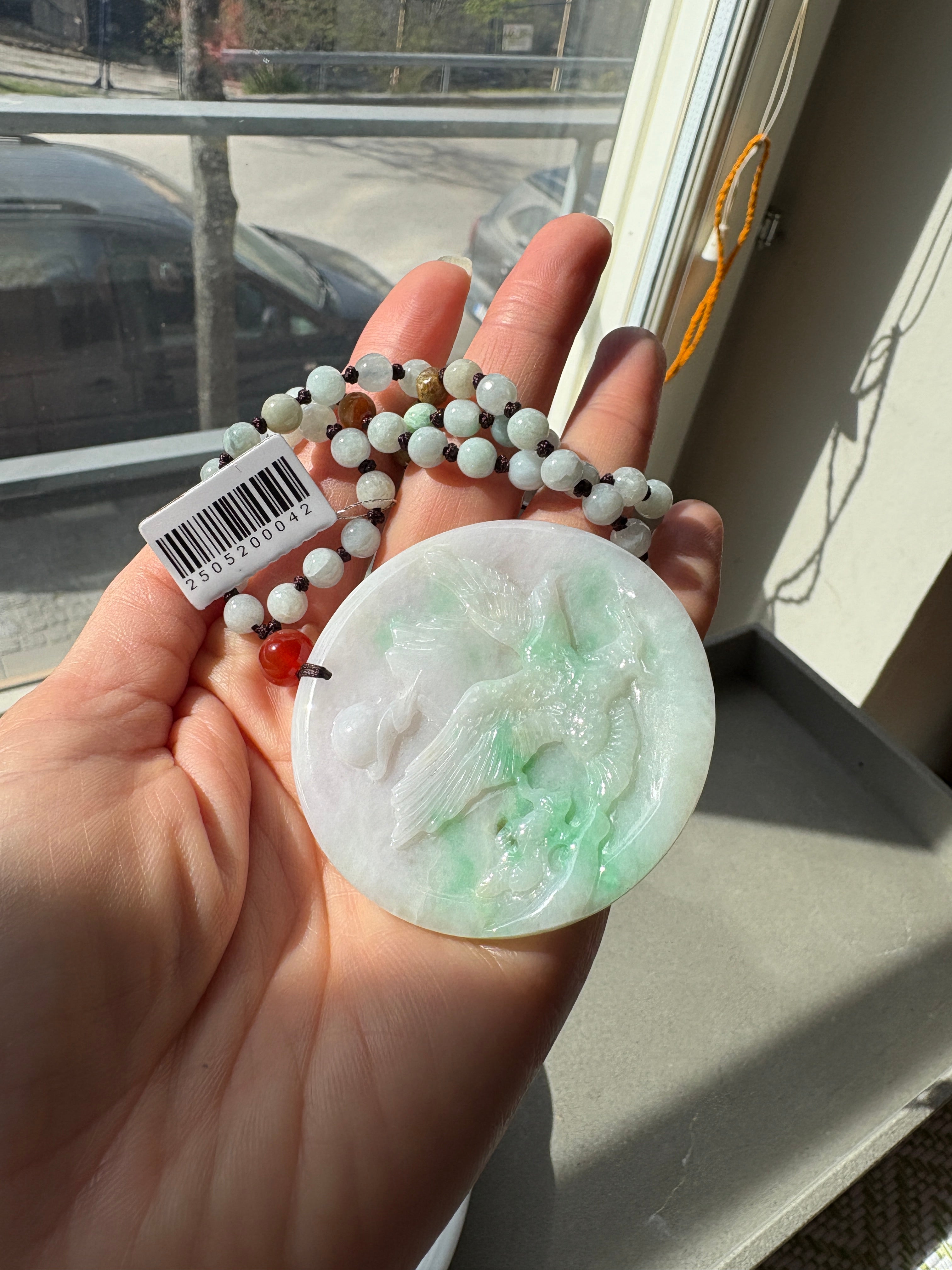 Jade necklace with carved pendant